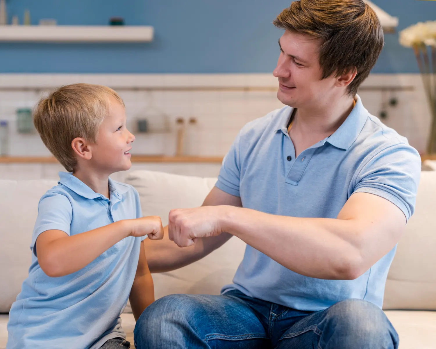Father and son bonding during parent-based counselling Calgary session