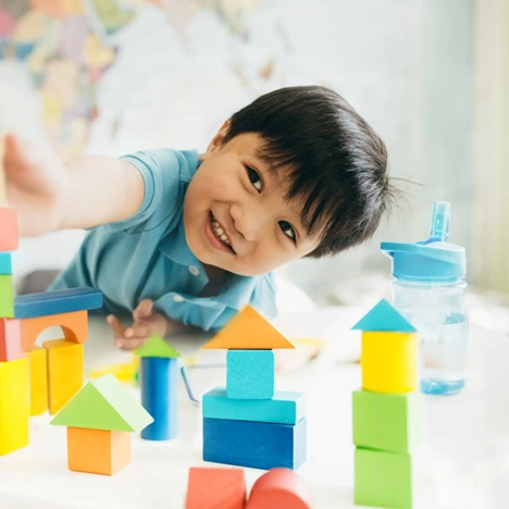 Child playing blocks during complex psychoeducational assessment