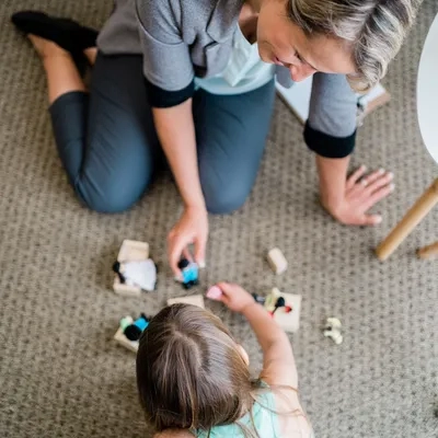 Adult and child playing autism spectrum disorder assessment
