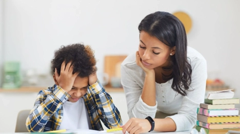 Student receiving help during standard assessment.